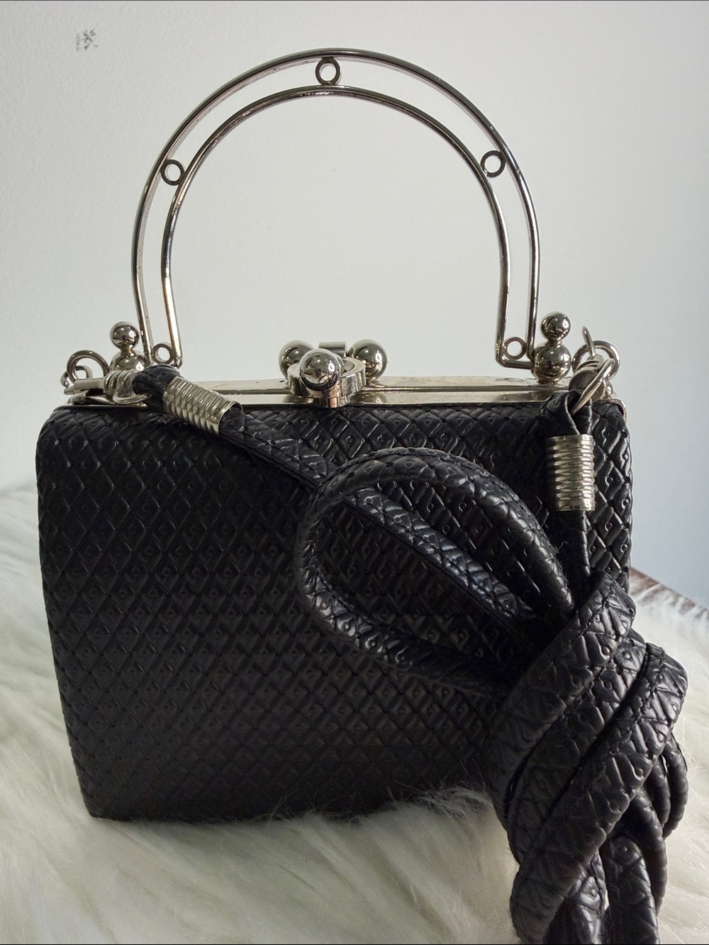 Small Black Clutch with detachable shoulder strap.  Silver accents NWT